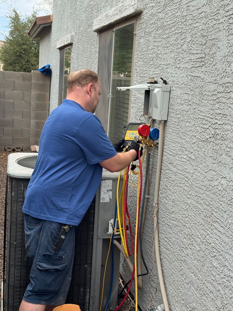 Airpex technician performing emergency AC repair in Chandler, AZ