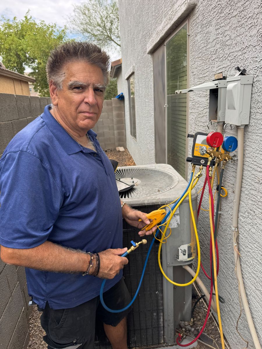 Airpex technician repairing an air conditioner at a Tempe, AZ rental property
